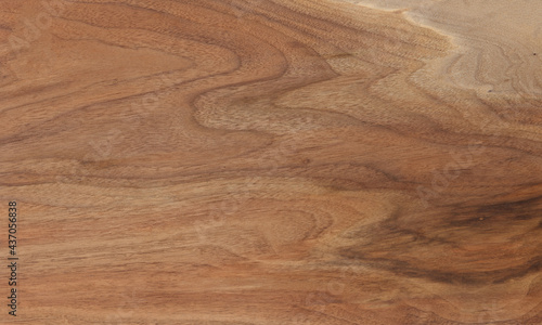Brown, beige and gray walnut wooden background. Walnut board surface