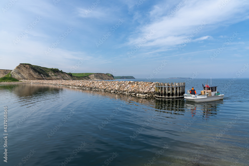 small fishing boat enters the harbor at Ejerslev Lynd small fishing boat enters the harbor at Ejerslev Lynd