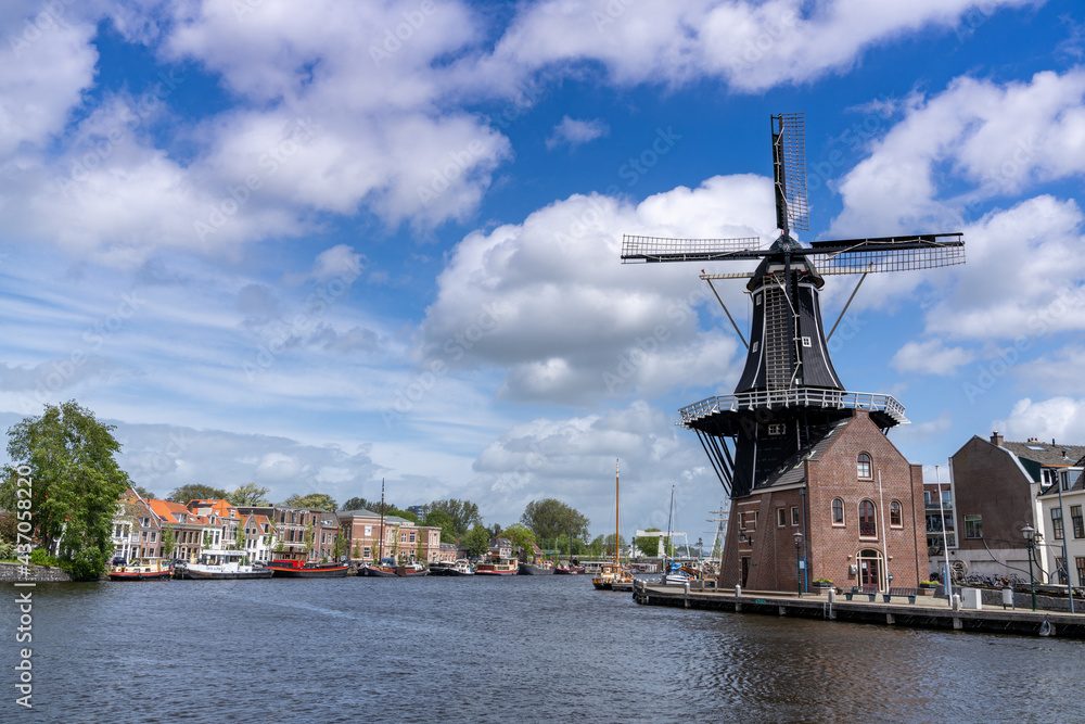 view of the Dee Adrian Windmill and Binnen Spaarne River in Haarlem