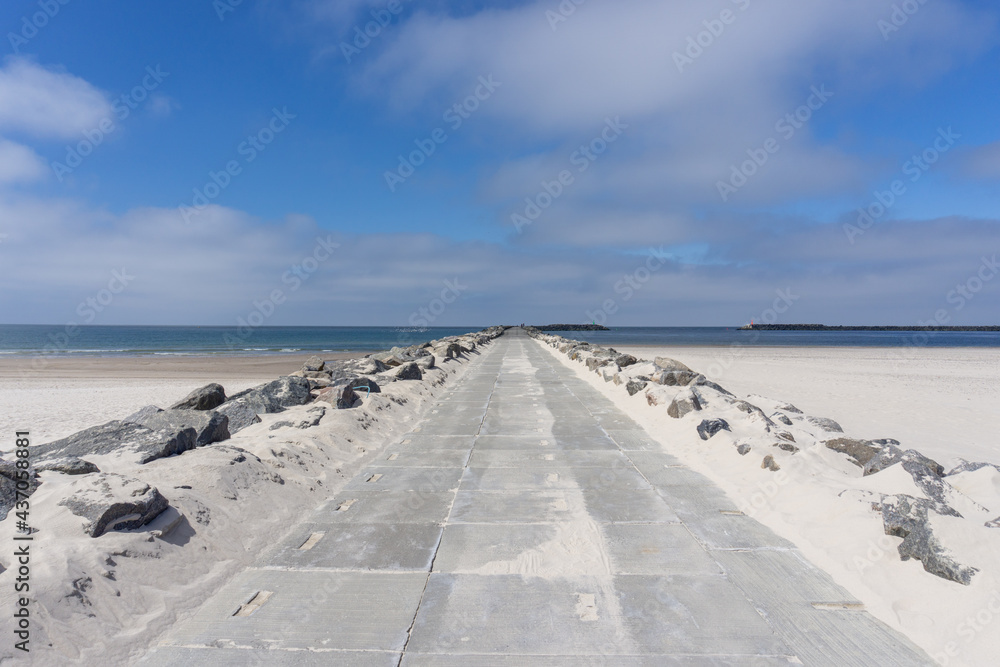 long rocky and concrete storm groin jetty to protect against erosion on the Wadden Sea coast of western Denmark long rocky and concrete storm groin jetty to protect against erosion on the Wadden Sea coast of western Denmark