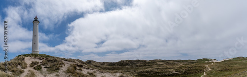 panorama view of sand dunes on the Jutland coast of Denmark with the Lyngvid Fyr lighthouse