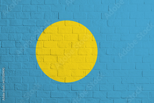 Flag of Palau. Brick wall texture of the flag of Palau photo