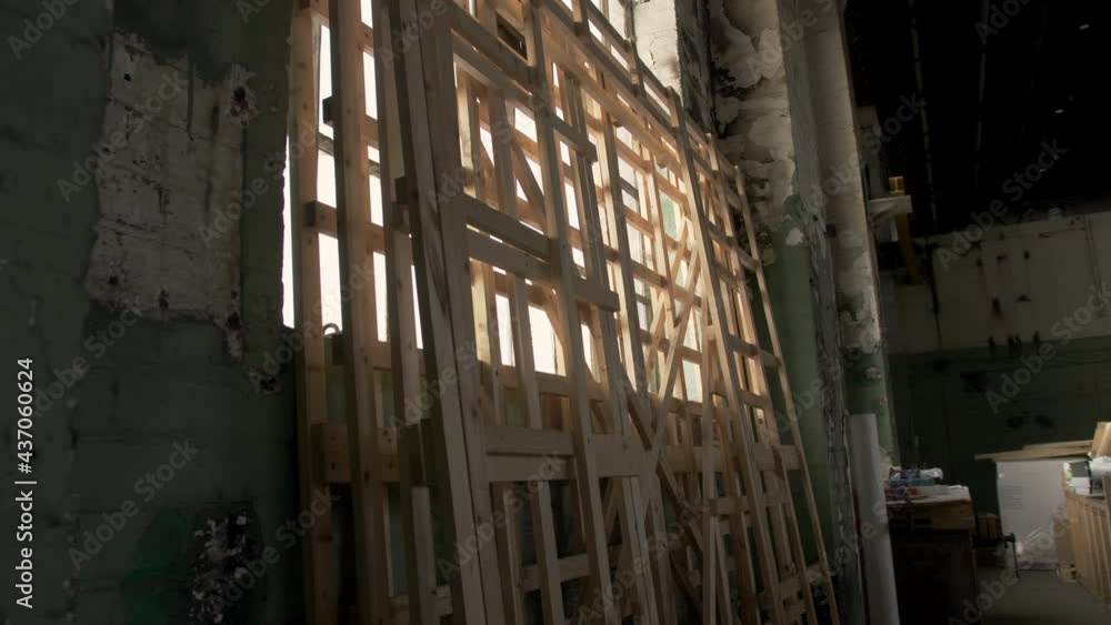 Wooden construction frames inside abandoned warehouse, England, UK Wooden construction frames inside abandoned warehouse, England, UK