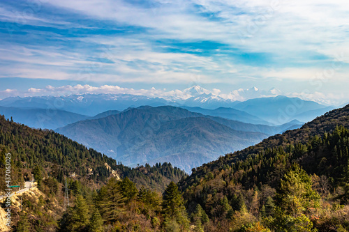 multilayer mountain range of himalaya with valley view and amazing sky at day from flat angle photo