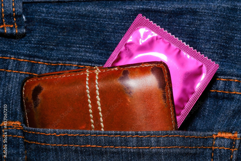 Condom in package in jeans. Men found condoms to prevent sexually transmitted infections or AIDS. Prevent HIV disease. Sexually transmitted disease. wallet	