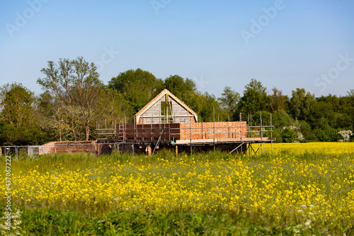 A rural old barn that is currently being renovated and converted for a new use and lease of life as a home