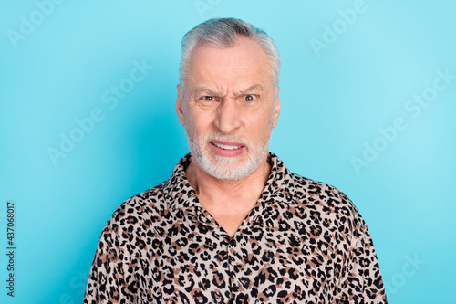 Photo of unhappy upset old man face disgust reaction bad mood summer isolated on blue color background