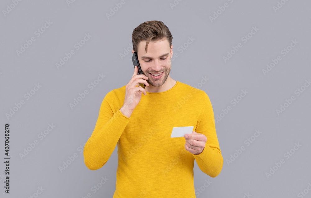 Connecting always. Happy man hold card talking on cellphone. Contact card. Mobile communication Connecting always. Happy man hold card talking on cellphone. Contact card. Mobile communication