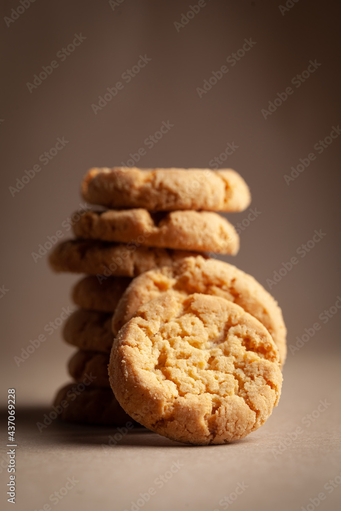 Close-up of stacking delicious freshly microwave oven baked simple cookies or biscuits. Close-up of stacking delicious freshly microwave oven baked simple cookies or biscuits.