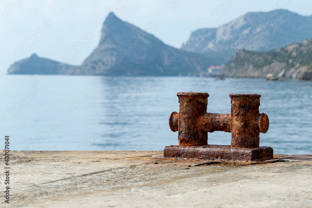 Knechts on pier against backdrop of sea and mountains. Knechts on pier against backdrop of sea and mountains.