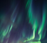Aurora borealis, Northern lights with stars glowing in the night sky