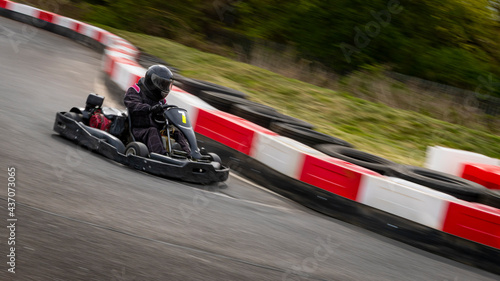A panning shot of a racing kart as it circuits a track. © SnapstitchPhoto