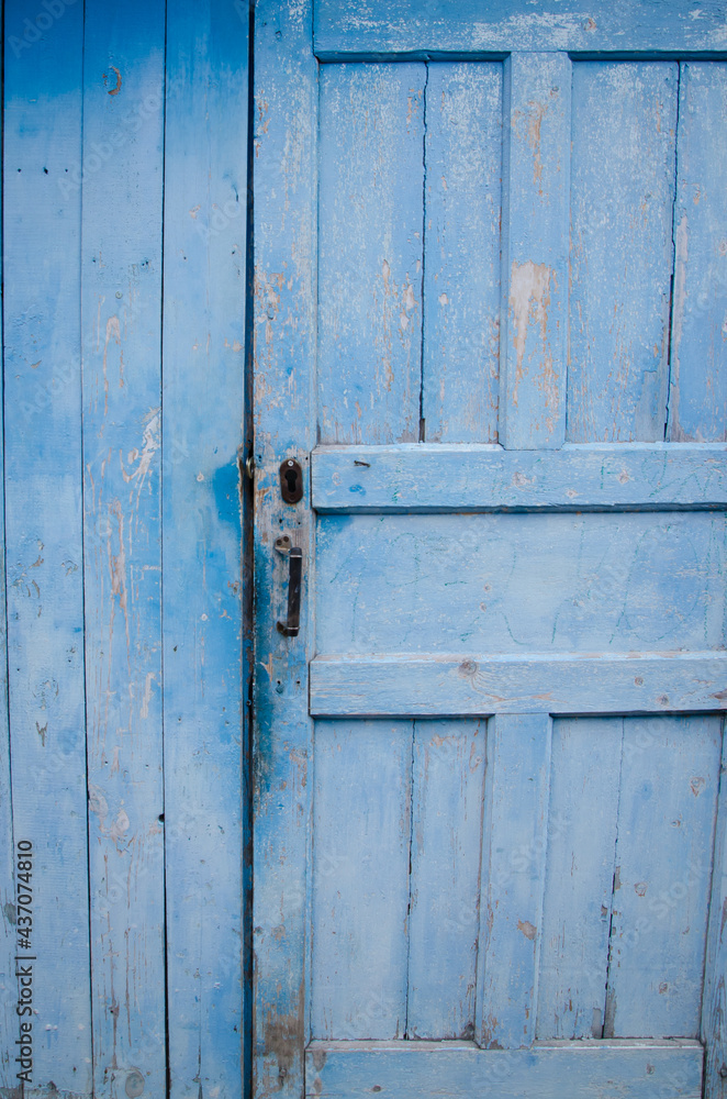 old blue wooden door, in a blue house