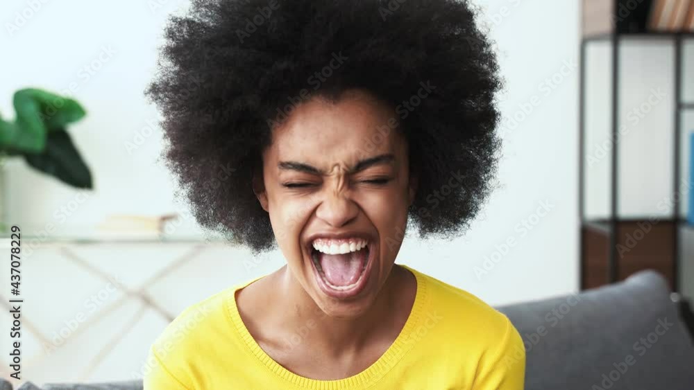 Beautiful african american woman smiling and laughing to the camera