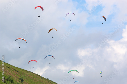 Paragliders in a blue sky 