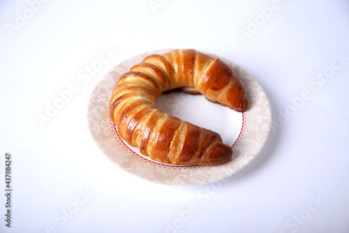 Fresh and tasty bagel with jam over white background