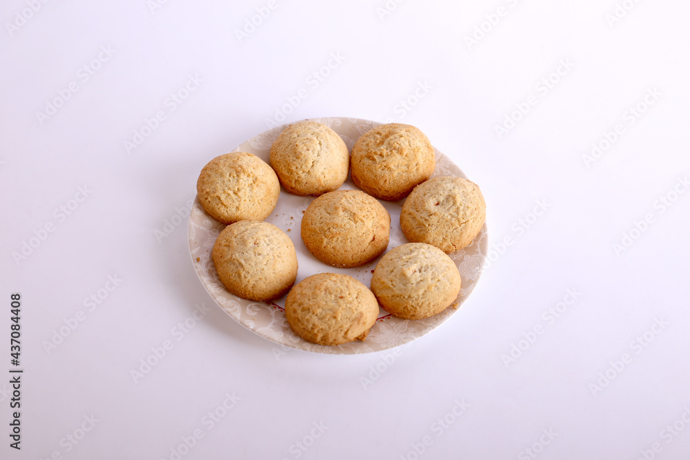 Amaretti cookies with almond on white dish. Amaretti cookies with almond on white dish.