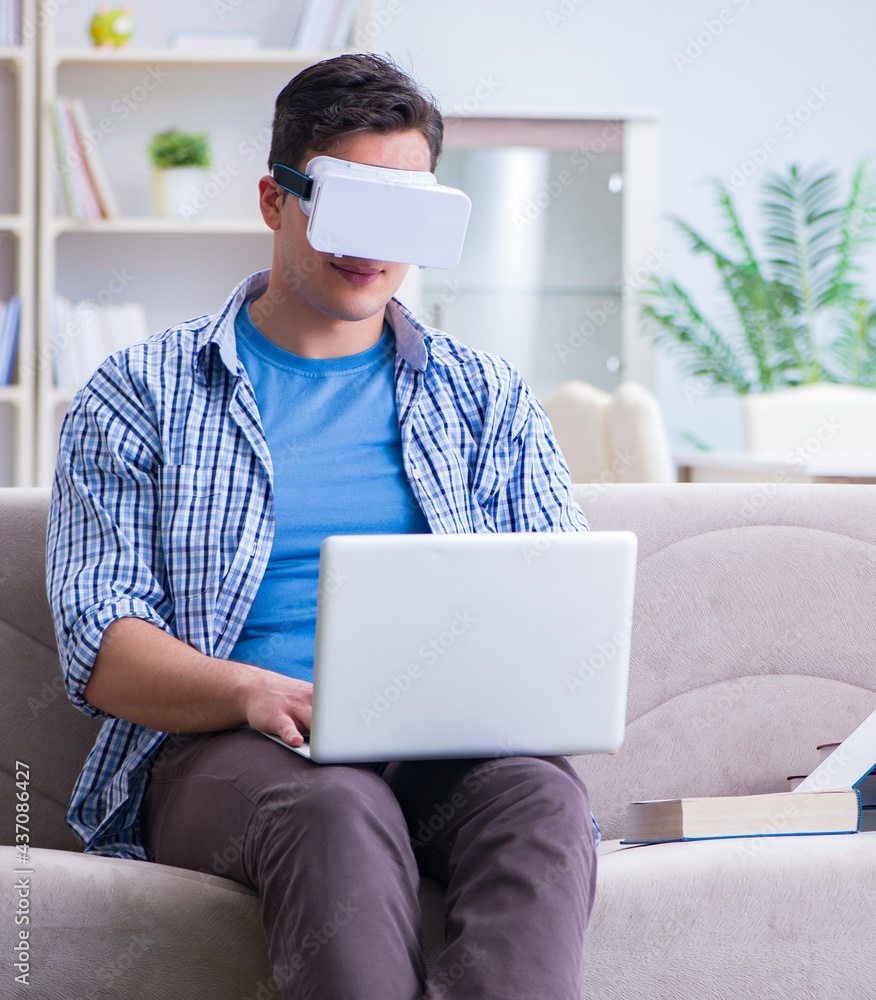 Freelance student with virtual reality glasses at home Freelance student with virtual reality glasses at home