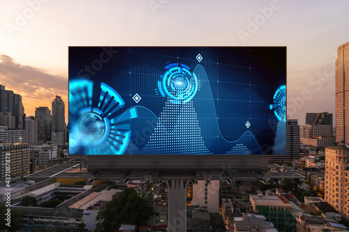 Glowing hologram of technological process on billboard, aerial panoramic cityscape of Bangkok at sunset. The largest innovative hub of tech services in Southeast Asia.