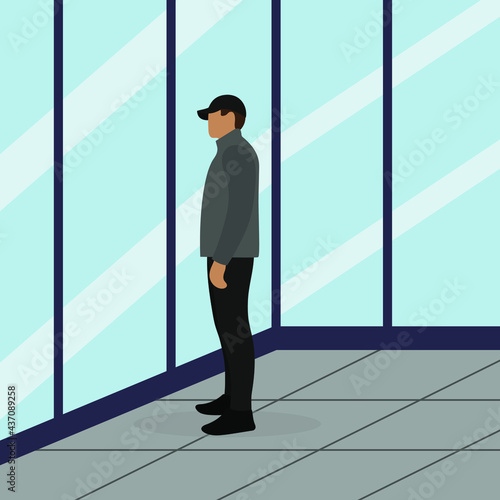 Male character in jacket and cap stands against glass wall © Tatyana