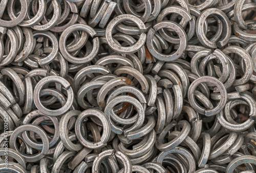 Steel grover washers for industrial manufacturing. Texture background of grover washers.
