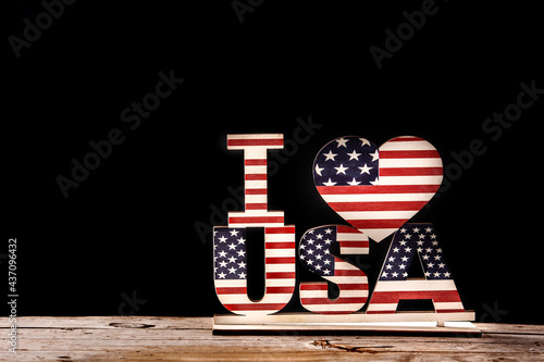 I love USA and stars ornament on woode table and black background