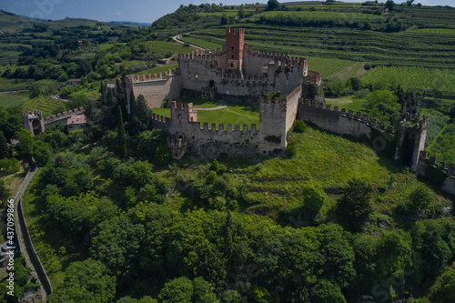 Soave castle aerial view, province of Verona, Italy. The famous medieval castle on the hill. Italian historic castles.