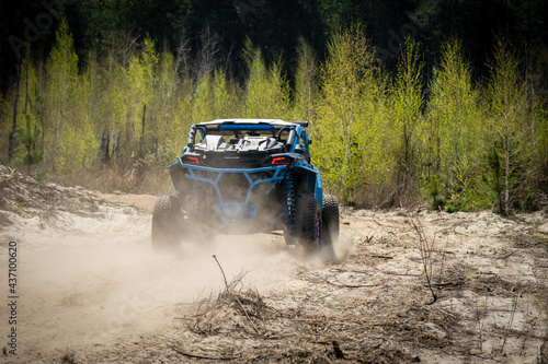 Summer UTV, ATV & offroad driving in dust. Quad racing © Anton Tolmachov