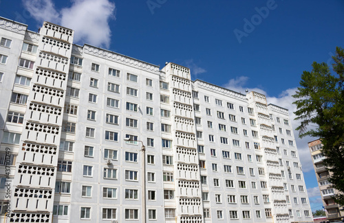 View from below on the facade of a modern multi-storey building with beautiful balconies