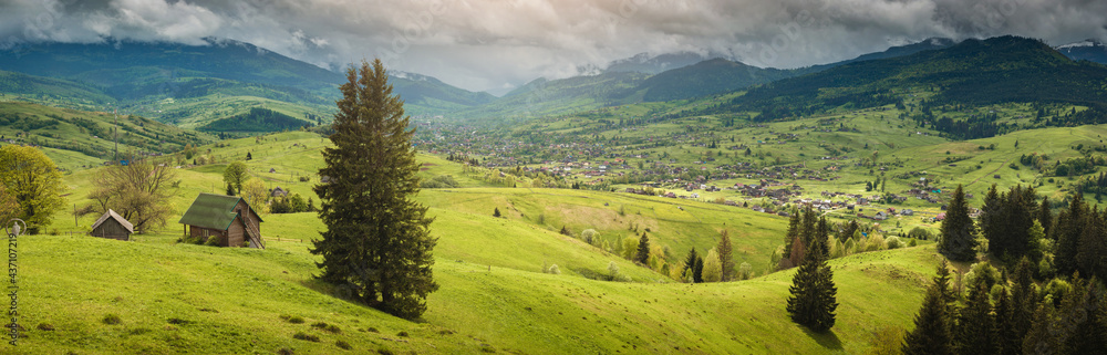 Alpine village on a spring carpathian rolling hills