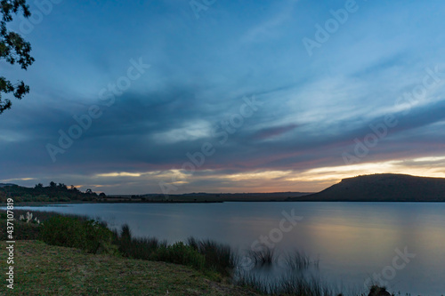 Fototapeta Naklejka Na Ścianę i Meble -  Small lagoon at the foot of the mountain ranges in the countryside of Argentina