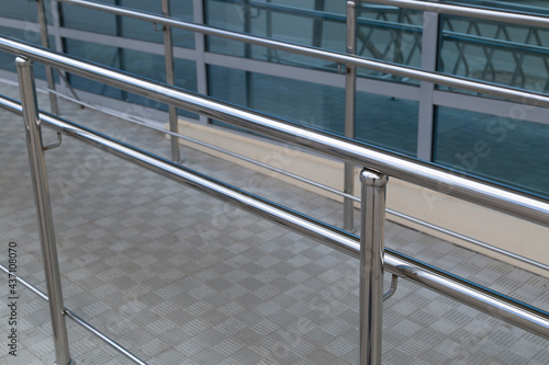 Stainless steel railing on the city street. Long-lasting railing.