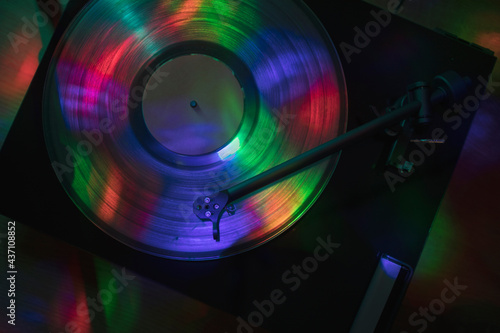 Turntable playing vinyl record at night club