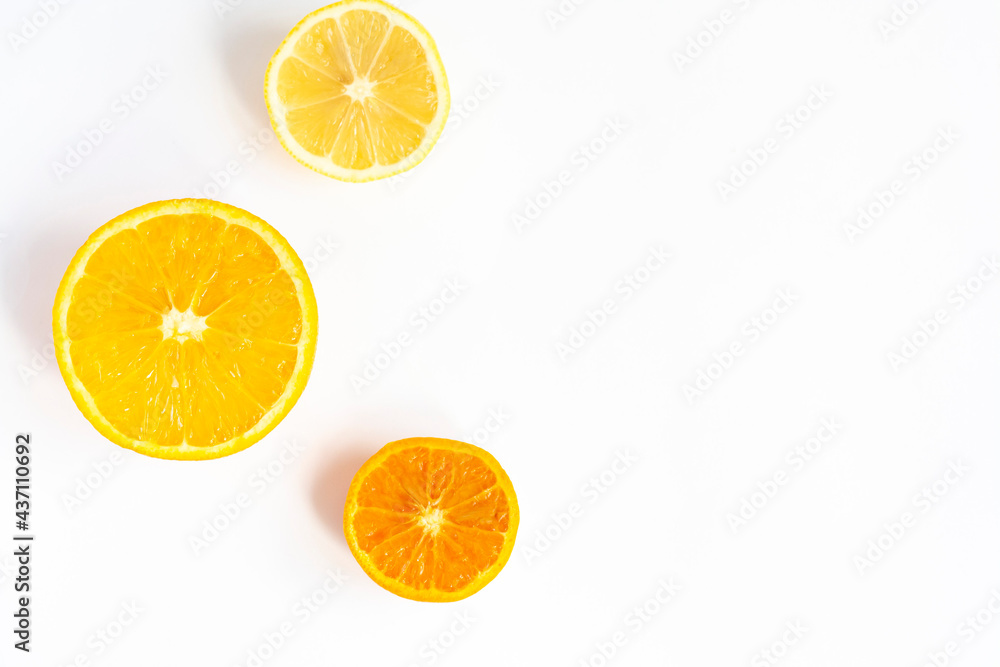 Ripe citrus fruit halves on a white background, copy space Ripe citrus fruit halves on a white background, copy space