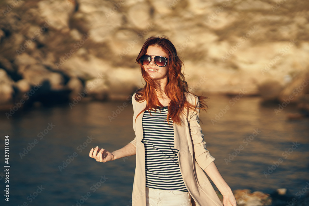 traveler on vacation in the mountains outdoors near the sea gesturing with her hands cropped view traveler on vacation in the mountains outdoors near the sea gesturing with her hands cropped view