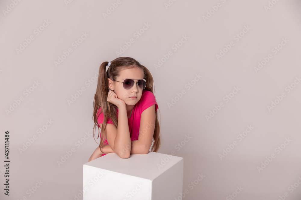 beautiful girl in sunglasses. advertising children's glasses beautiful girl in sunglasses. advertising children's glasses