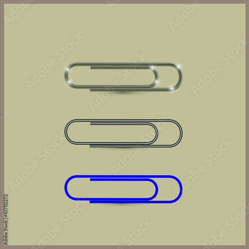 Set office paper clips. Metal, iron, plastic paper clip on a beige background.