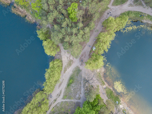 Lake in the park in spring. Aerial drone view.