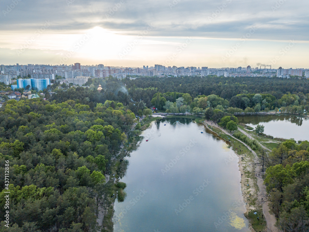 Lake in the park in spring. Aerial drone view.