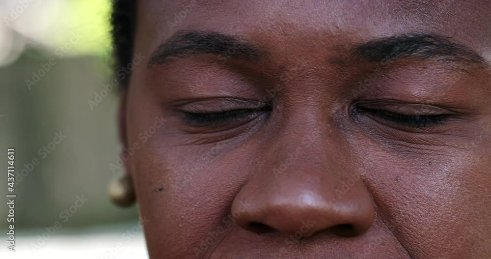 African black woman closing eyes in meditation and contemplation African black woman closing eyes in meditation and contemplation