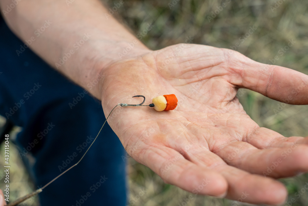 Close up photo of male hand with fishing gear Close up photo of male hand with fishing gear