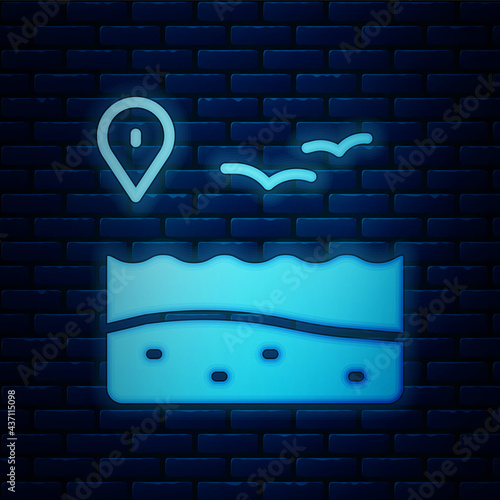 Glowing neon Location with beach icon isolated on brick wall background. Tropical beach landscape. Good sunny day. Vector