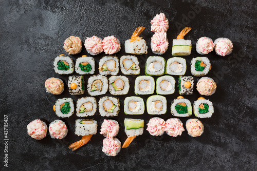 Sushi rolls set on a black background