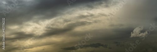 a wide panoramic view of a fantasy dramatic sky in a light haze with a warm sunset glow and a lonely cloud on the side. artistic photo for atmospheric design