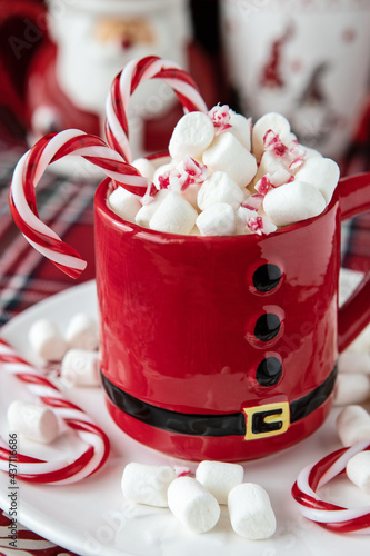 Red mug with hot chocolate and marshmallows   for christmas holiday