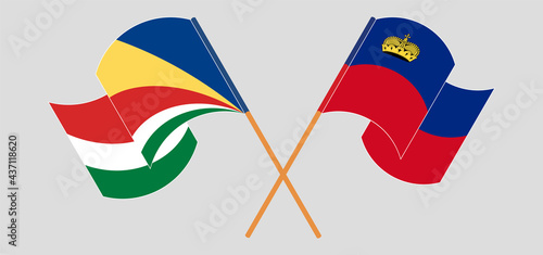 Crossed and waving flags of Seychelles and Liechtenstein