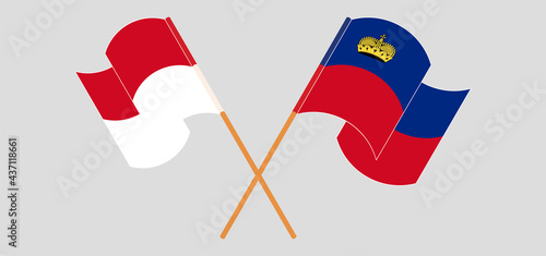 Crossed and waving flags of Monaco and Liechtenstein