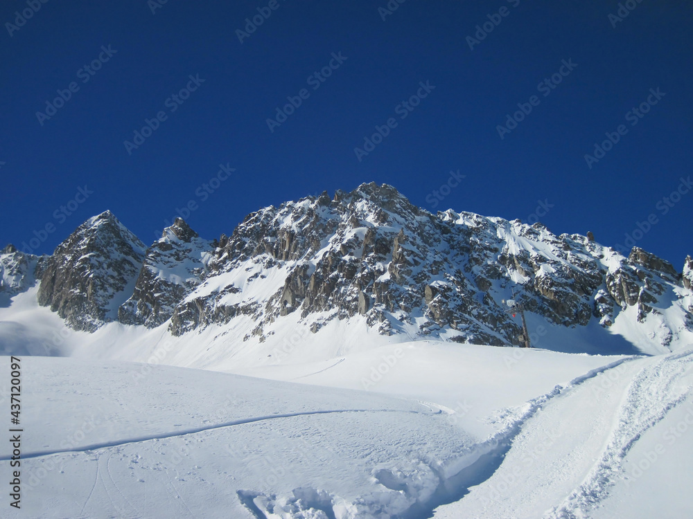 Snowy mountain peaks in sunny weather, landscape