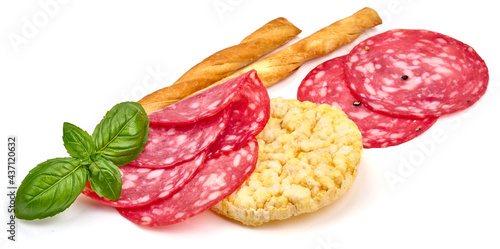 Spanish cured sausage, salchichon, isolated on white background. High resolution image.