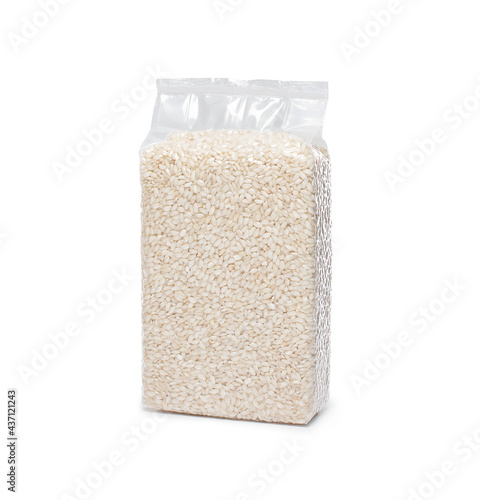White rice in vacuum sealed plastic bag on white background. Rice packaging blank mockup